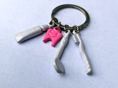 Pink tooth with Brush, Paste and Mirror Charms keychain
