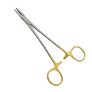 Crossed surgical scissors with gold-colored finger rings on a white background.