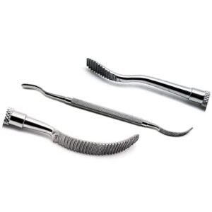 Three stainless steel dental instruments with textured handles and curved tips on a white background.