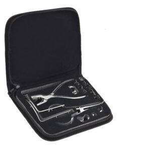 Open black zippered case containing stainless steel dental/surgical instruments arranged in foam padding
